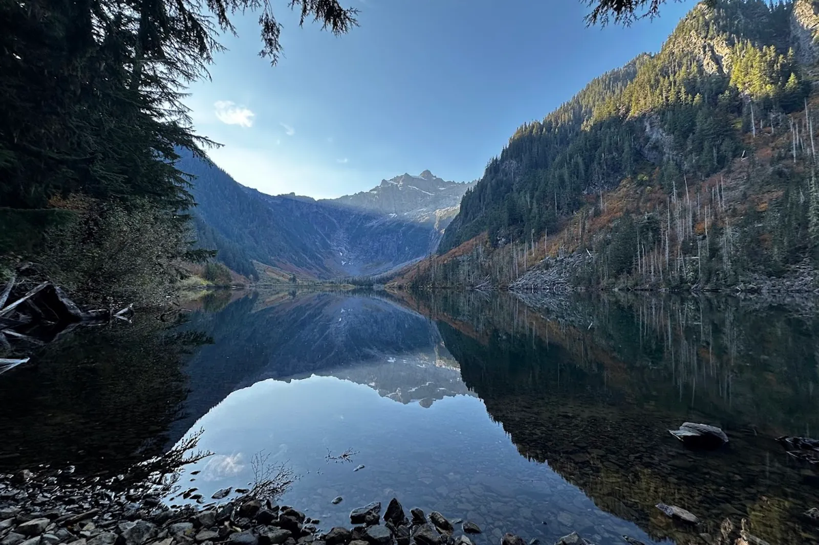 Lake reflecting the mountains in the morning at Goat Lake
