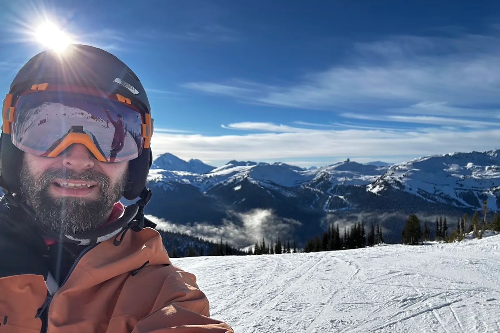 Joshua waving from the top of 7th Heaven at Blackcomb mountain resort
